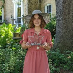 Jessica Blackwood holding the 2022 CUCCIO Community award for their work in digital accessibility at McMaster.